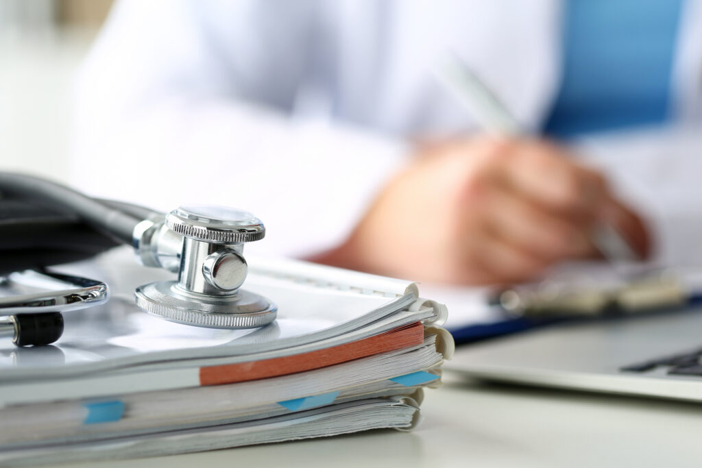 doctor filling a form in